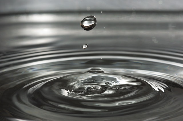 a drop of water causing a ripple