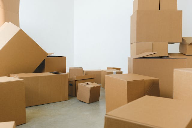 A room full of cardboard moving boxes.