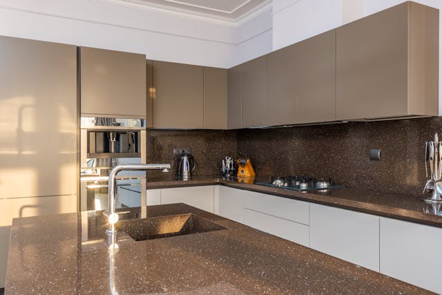 A kitchen with a large island counter